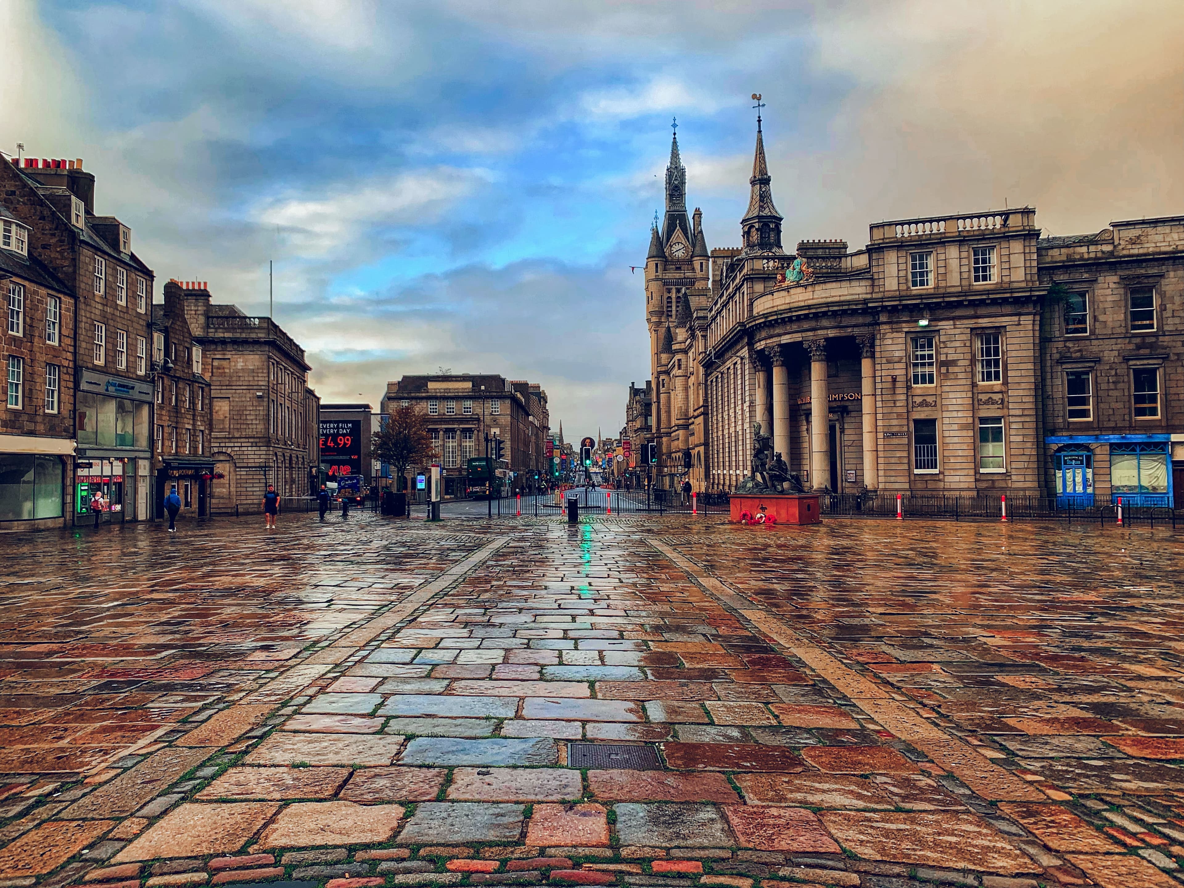A view of Aberdeen's historic city centre, with its distinctive granite architecture and open plaza, showcasing the character of Scotland's "Granite City."