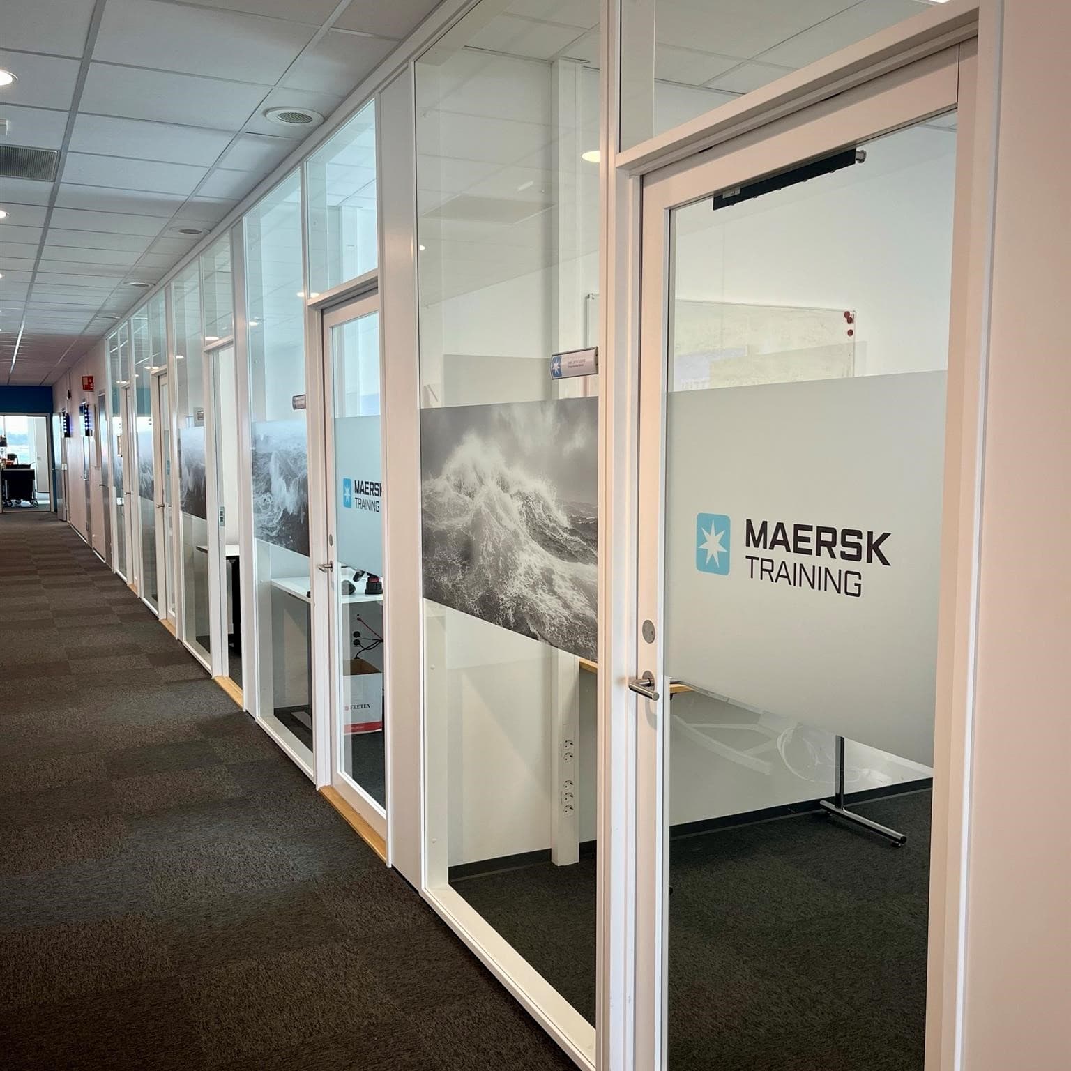 Inside the Maersk Training facility in Tanager - showing a corridor with classrooms leading off